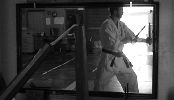 The author A. Quast practicing inside Nagamine dojo in Naha Kumoji, February 2008.