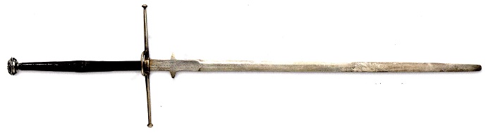 Bidenhänder. Date 1550. Origin Germany. Weight 3.18 kg. Length 140 cm. Such swords were carried in Germany mainly by the soldiers defending the company flag. They were carried over the shoulder. In order to "shorten" the handle in close combat, the blade was grabbed at the ricasso, the hooks protected the hand.